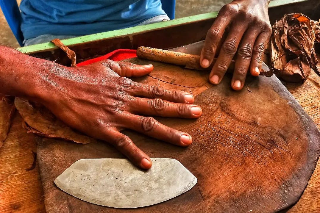 Man rolling a cigar by hand